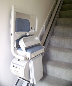 Chair lift for disabled people to climb stairs at home