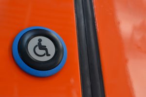 Automatic door opener with wheelchair on button